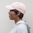 Side view #7965 Straight Peek-A-Boo Halo shown in (2) Darkest Brown with #9114 Cotton Knit Baseball Cap in Pink Pearl