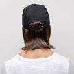 Back view #8791 Shorty Wig with Black Hat, wig shown in 8H Medium Brown w/Golden Brown Highlights