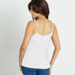 Back view of the #9408 Cool Comfort Pocketed  Lace Trim Camisole shown in white.