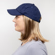 Side view #9441 Classic Wig with Navy Hat shown in (27AH) Dark Strawberry Blonde with Dark Blonde Highlights