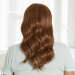 Back view #9973 Synthetic Headband Wig by Encelia® Hair shown in Natural Red