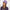 Front view #8306 Cotton Conductor Hat with Buckle Shown in Light Orchid with Shoulder Length Straight Halo Hairpiece (#8063) in (829) Sunkissed Brown 