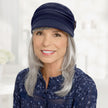 Front view #8306 Cotton Conductor Hat with Buckle Shown in Navy with Shoulder Length Straight Halo Hairpiece (#8063) in (5660) Light Frosted Grey
