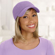 #8374 Mid-Length Halo with Bang by EverYou shown in (1621) Sunkissed Blonde with Cotton Knit Baseball Cap (#9114) in Light Orchid 