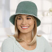 Front view #9503 Distressed Cotton Bucket Hat Shown in Sage with Gabor® Under Cover Halo (#8744) in GL14-22 Sandy Blonde
